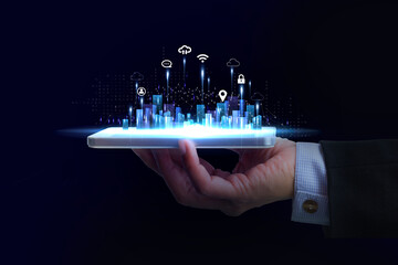 Hand holding smart city and communication network concept. (Internet of Things), Digital transformation