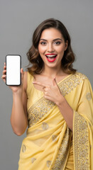young indian woman pointing with finger on blank mobile screen