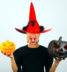 Portrait of surprised woman in halloween costume. Halloween. Holidays. Red hat. photo. People....