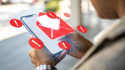 Spam email alert, phishing warning on smartphone, red exclamation mark notification, cybersecurity threat, digital scam detection, person checking dangerous email, mobile phone with security risk