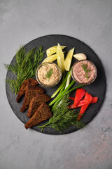 Delicious appetizer platter on a stone board