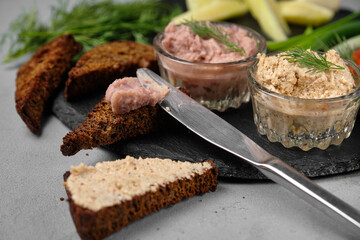 Close-up of appetizing pate with bread and fresh herbs