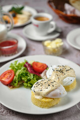 Breakfast with poached eggs and coffee