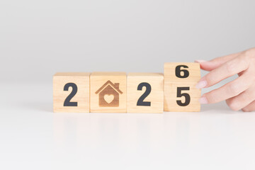 2025 end year to Happy New Year 2026 with Home and Heart block. Property investment, House Mortgage, Real Estate tax, homeless, donation, Financial and happy family concepts