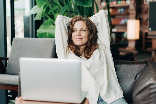 A young businesswoman working in a modern office took a break to rest.