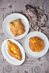Assortment of Georgian khachapuri on plates