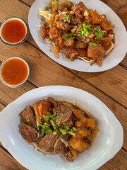 Braised beef rice noodle with bean sprout garlic chili sauce Asian cuisine street food savory aroma rustic table