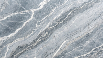 Fototapeta premium Elegant gray marble surface with intricate veining and subtle patterns perfect for countertops, flooring, or decorative accents in modern spaces.