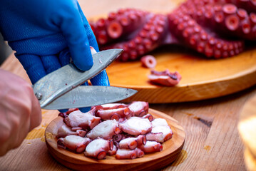 The culinary skill of serving traditional Galician style octopus The Pride of a Culinary Tradition © VicVaz