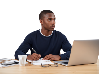 Focused young professional working at a desk with laptop and notepad on isolated seamless background