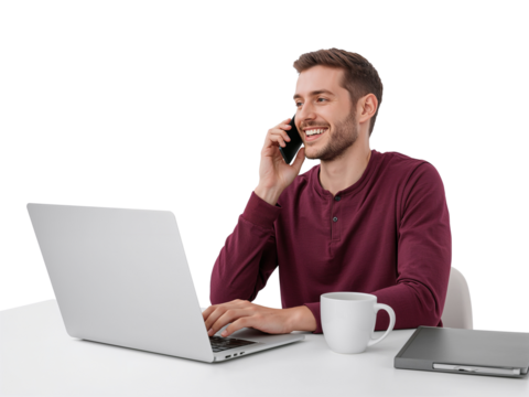 Cheerful entrepreneur making a phone call while working on his laptop computer at home for remote