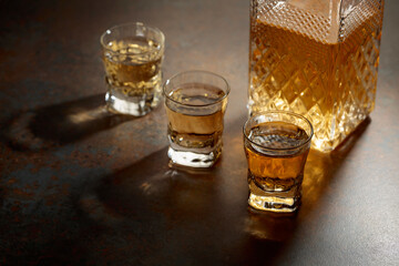 Decanter and small glasses of whiskey.