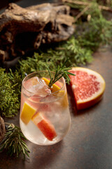Refreshing hard seltzer with ice, grapefruit, and rosemary.