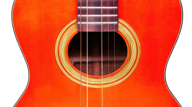 Close-up of an orange ukulele's soundhole