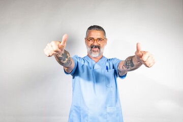 Confident medical professional giving thumbs up.