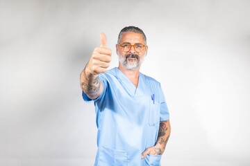 Healthcare professional giving thumbs up in studio.