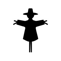 Silhouette of a traditional scarecrow wearing a hat with arms extended outward