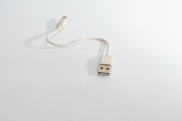 A white USB cable with a standard USB-A connector, isolated on a clean white background,...