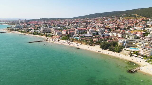 Sandy beach, hotels, houses and marina port in Sveti Vlas. Panoramic aerial view of houses and hotels, sea and beaches of Sveti Vlas in Bulgaria from above, top view from drone. Summer holiday in Euro