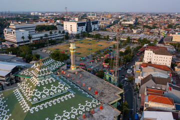 Aerial view of urban cityscape with mosque and park