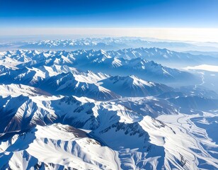 Fototapeta premium Majestic Snow-Covered Mountain Range Under Clear Blue Sky
