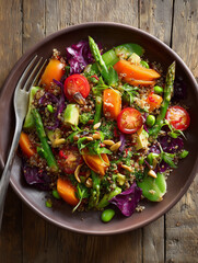 Quinoa salad with roasted vegetables and pine nuts on rustic wooden table