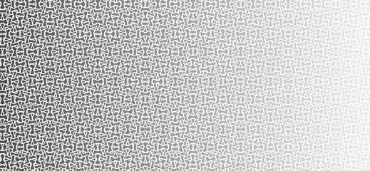 Abstract pattern of repeating geometric shapes fading into white space.
