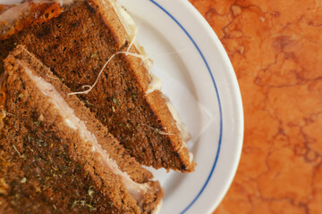 Traditional Portuguese fast food toast with bacon and cheese on a plate. Solo tourism and travel.