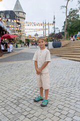 Family with children, visiting the Golden bridge with big golden hands holding it in Da Nang, Ba Ha...