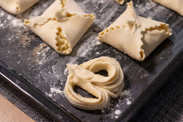 Close up shot of the cottage cheese pastries on the baking tray. Food