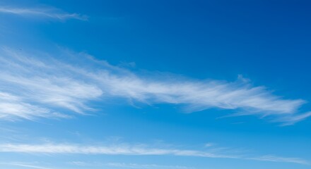 Fototapeta premium Vast Expanse of Brilliant Blue Sky with Fluffy White Clouds