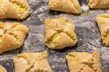 Close up shot of the cottage cheese pastries on the baking tray. Food