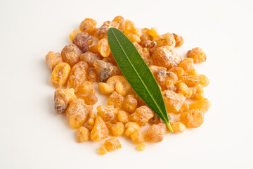 Frankincense or olibanum aromatic resin isolated on white background used in incense and perfumes.