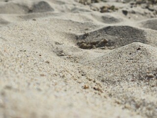 footprint on sand. A close-up of textured beach sand