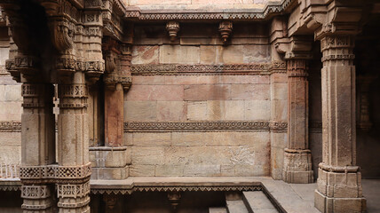 India, Gujarat, Ahmedabad, Beautiful Carvings on the Pillars and Wall of Adalaj Stepwell, Late 15th Century Carvings During Vaghela Dynasty of Gujarat.