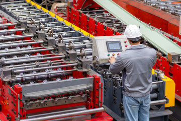 Industrial Engineer in Hard Hats.Work at the Heavy Industry Metal Sheet Manufacturing Factory....