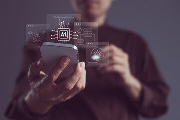 Close-up of businessman using smartphone with AI technology icons for smart automation, mobile efficiency, and real-time business workflow optimization