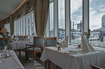 Formal elegant restaurant dining room onboard luxury cruiseship or cruise ship liner with set...