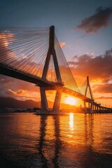 Obraz premium A cable-stayed bridge at sunset over water