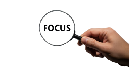 Hand holding magnifying glass over the word FOCUS isolated PNG with Transparent Background