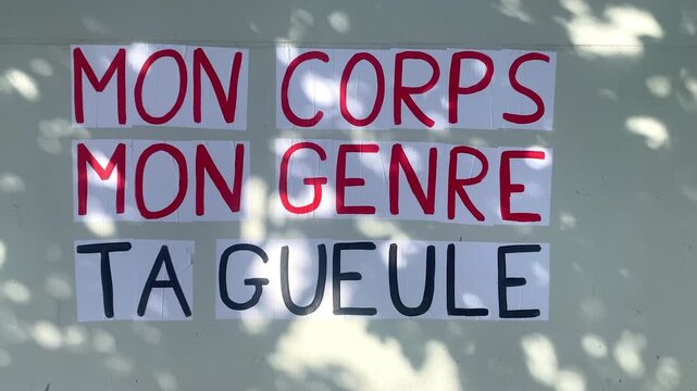 Protest poster pasted by members of a french feminist movement saying "my body, my gender, shut up"
