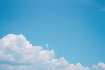 A bright azure sky alongside a sky filled with white clouds