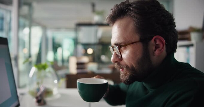 Creative, office and man with coffee, computer or proofreading article on website, happy and online. Review, story and reporter with hot beverage, media and person with tech for news and magazine