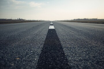 Airport runway texture featuring asphalt road striping