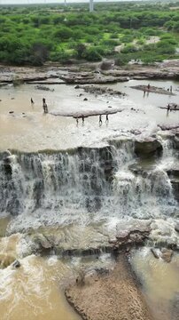 4K Drone shot of Beautiful waterfall. Kutch. Gujarat. India. Monsoon waterfall in kutch hills. Nature landscape. Travel background.