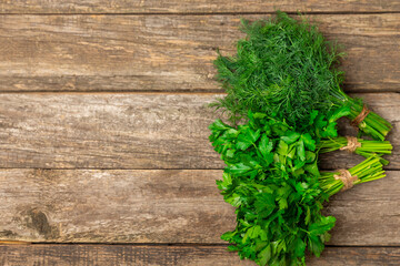 Dill and parsley on the texture table. Mixed bunch of fresh parsley and dill. Fresh aromatic spicy...