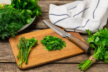 Dill and parsley on the texture table. Mixed bunch of fresh parsley and dill. Fresh aromatic spicy...