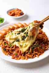 Korean spicy instant noodles with kimchi, sausage and mozzarella cheese