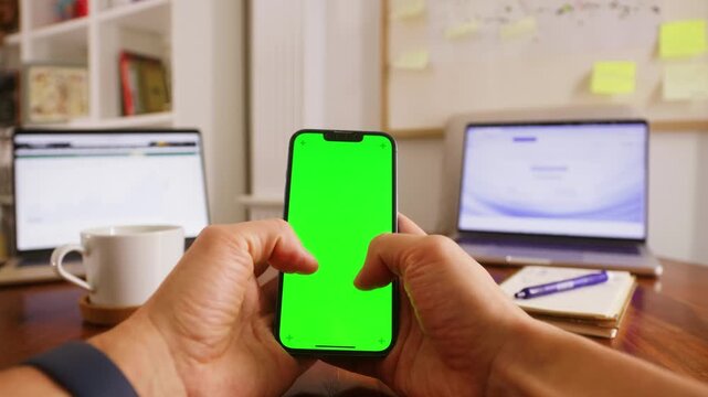 IT engineer holding phone with chroma key green screen, man working with chatbot AI online, connecting with AI and using a new chatbot. High quality 4k footage