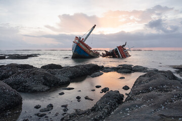 Old boat at evening skyline background, scenery view at shore of Ang Sila Village in thailand suite...